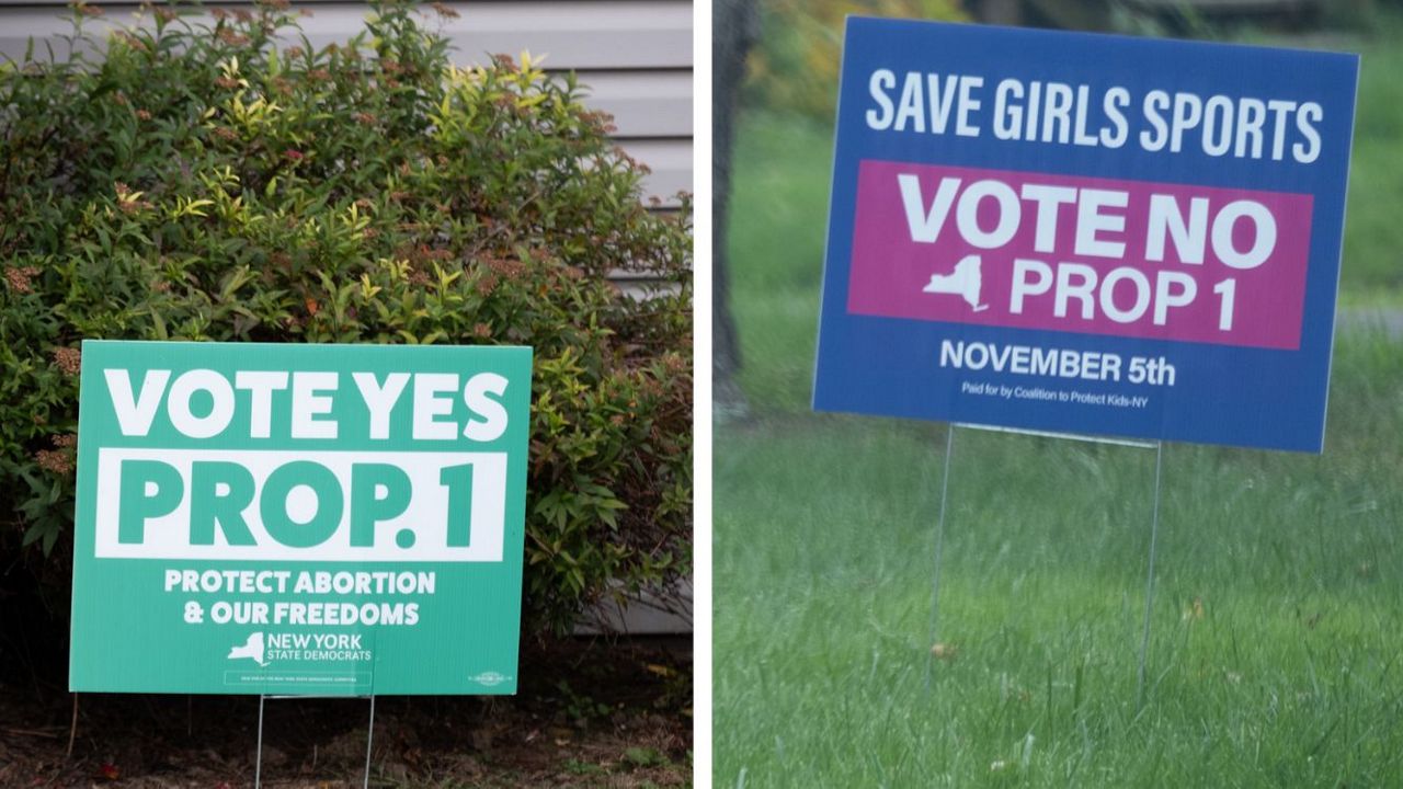 Empire Posts searched and published this image of Signs encouraging people to vote for and against proposition 1